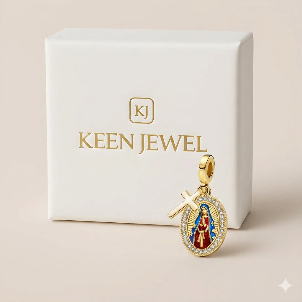 Gold pendant with religious design on a Keen Jewel branded box