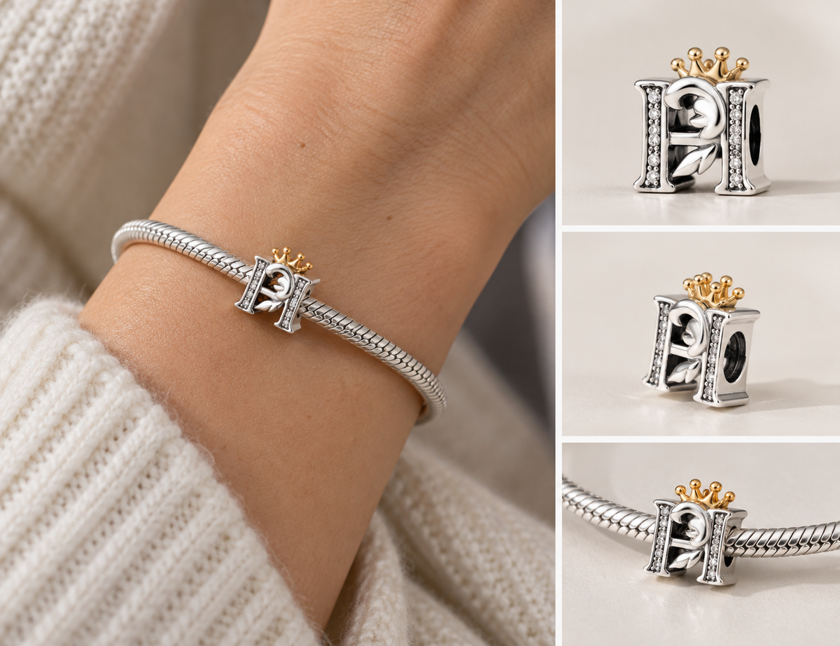 Silver H letter crown charm worn on a snake-chain charm bracelet, with close-up views