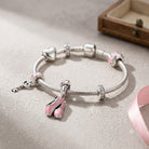 A Bellet Charm For Pandora Bracelet, featuring a pair of pink ballet shoes with a silver bow detail, crafted in 925 sterling silver and enamel.
